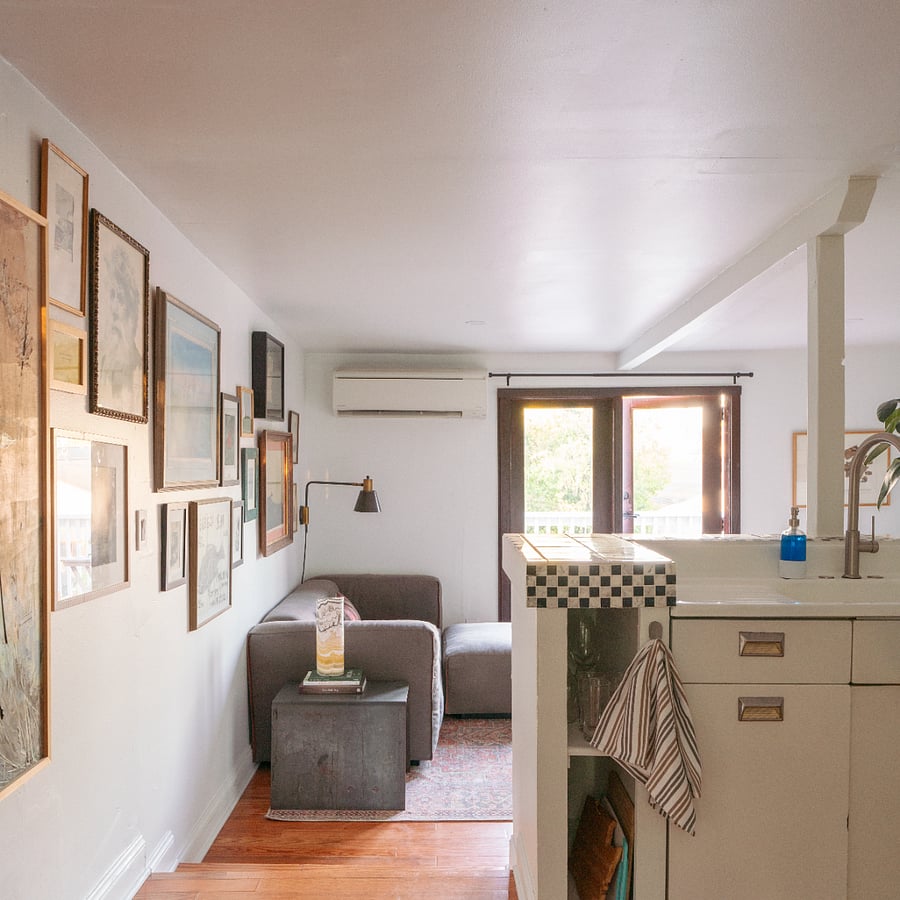 Charming antique cast iron sink (with new faucet) overlooks the living room.