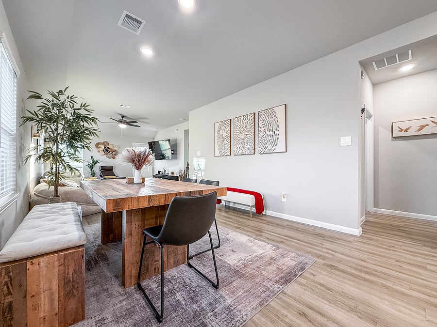 Open-concept layout with spacious dining and living areas, modern dcor, and bright natural light. Designed for comfort, connection, and easy entertaining.