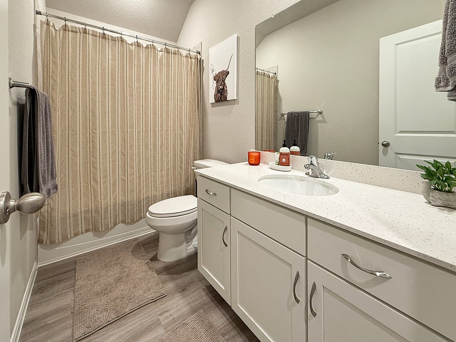 Cozy bedroom with a comfortable bed, desk setup, and Smart TV. Ideal for work-from-home travelers, teens, or long-term guests.