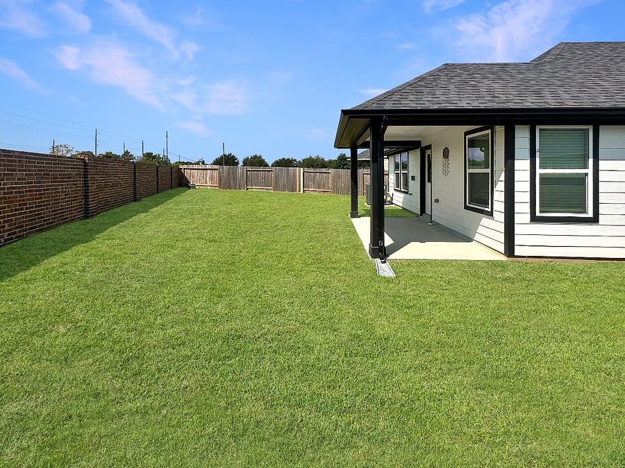 Expansive fenced backyard offering privacy, open space, and plenty of room to relax or enjoy outdoor activities.