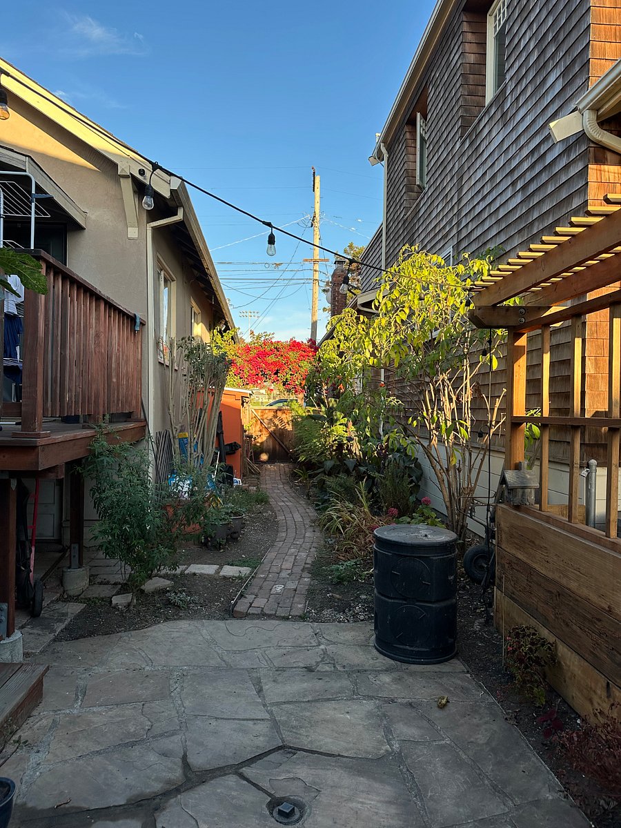 View from the entry door of cottage to gate leading to street