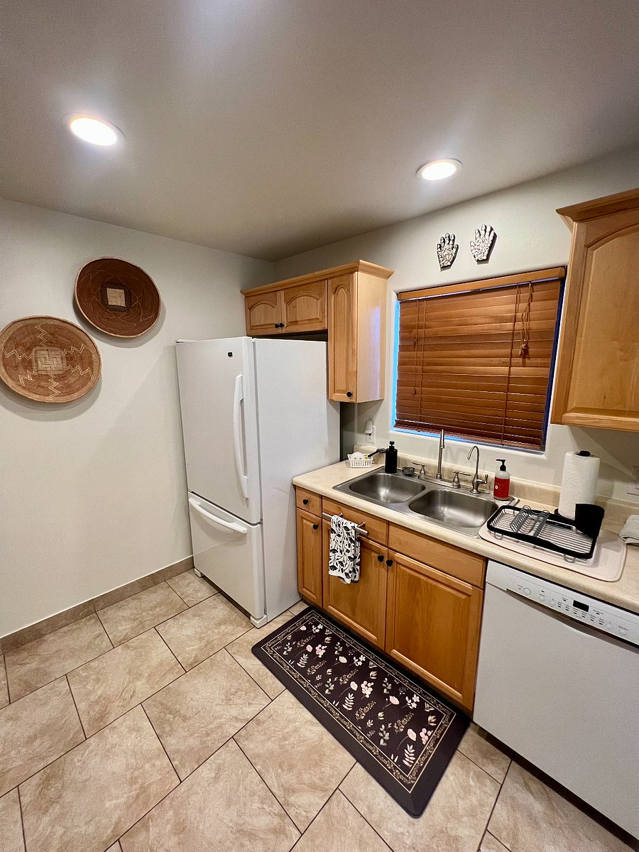 Kitchen featuring large refrigerator with ice maker