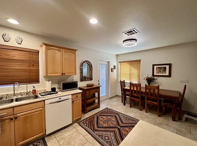 Kitchen and dining area featuring a beautiful dining room table that when pulled away from the wall can seat up to eight.