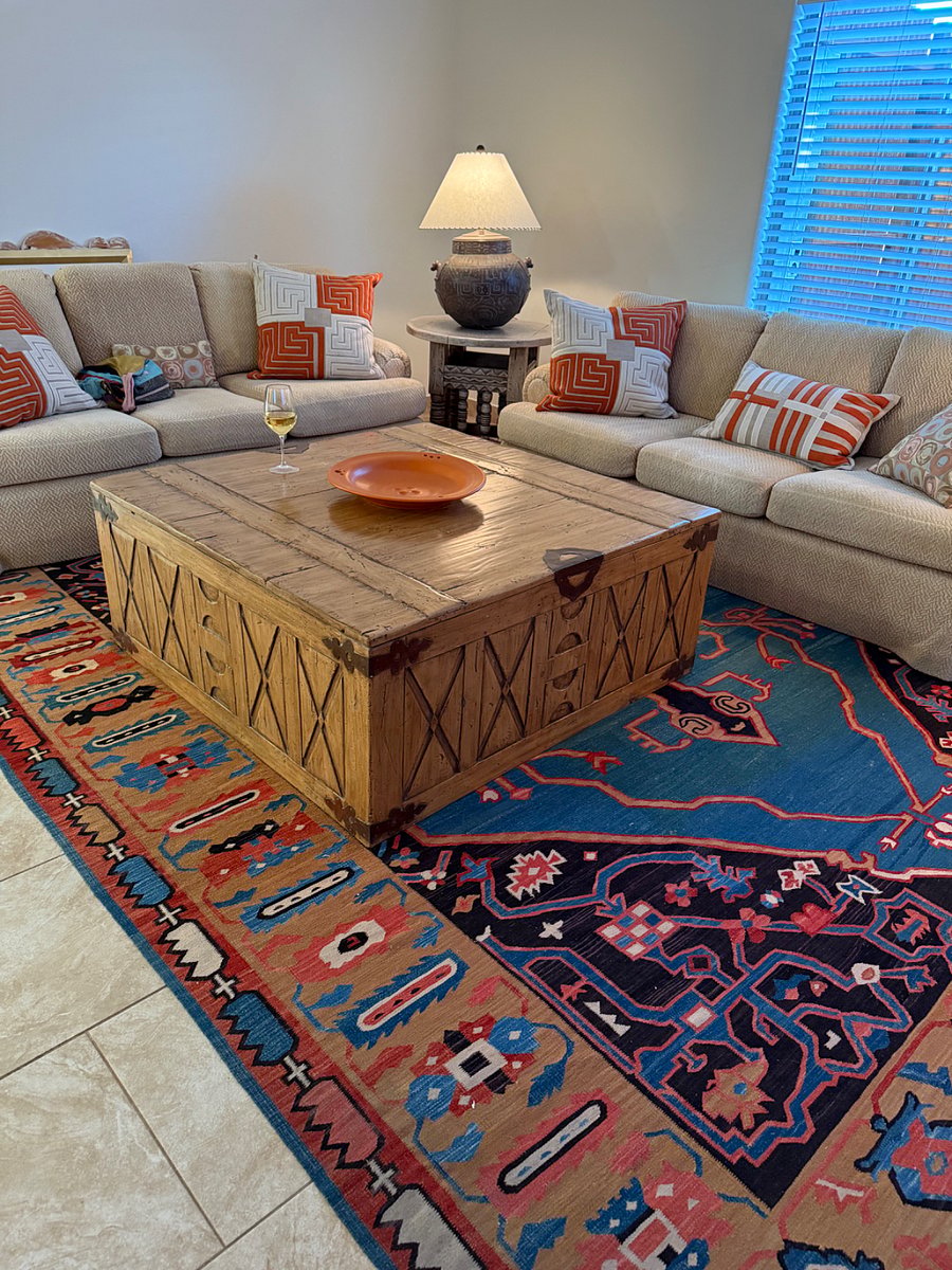 Large coffee table in living room with twin couches, all custom made.