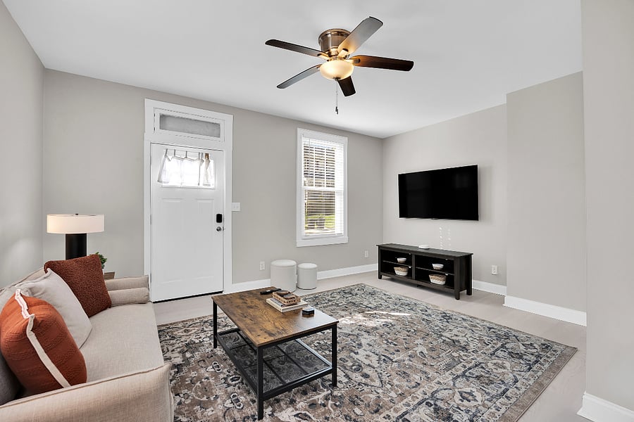 Cozy living area featuring a brand new 65" TCL 4K Smart Google TV and high-speed Wi-Fi for effortless streaming and relaxation.