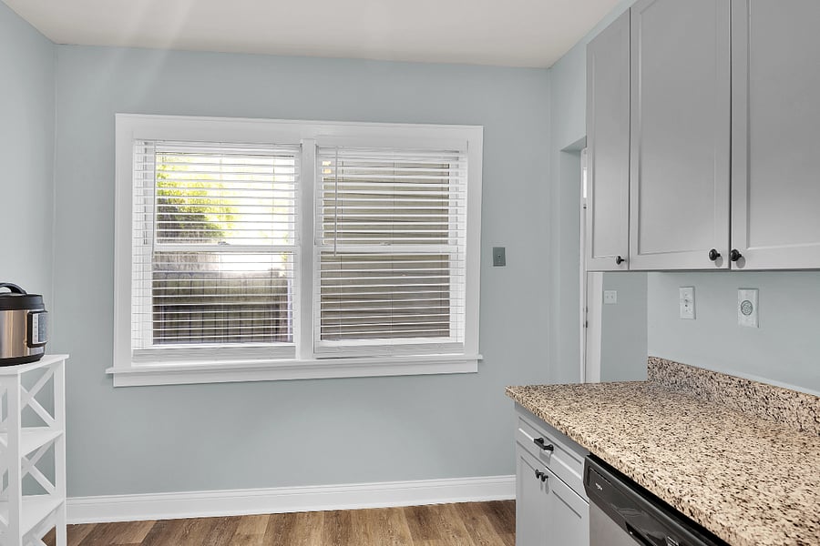 Fully equipped kitchen with full-size appliances, cookware, and coffee maker for extended stays.