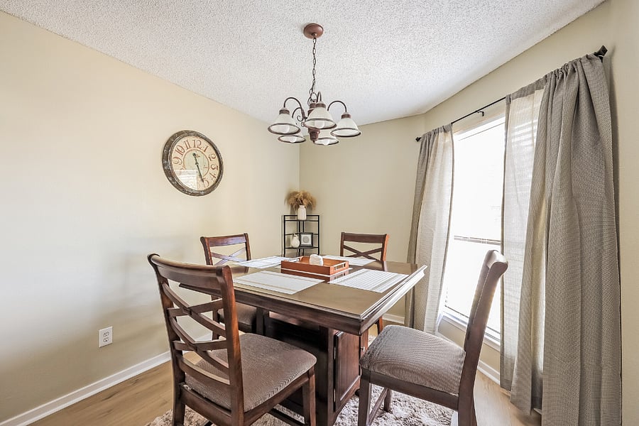 Separate dining area adjacent to the kitchen, suitable for meals or workspace use.