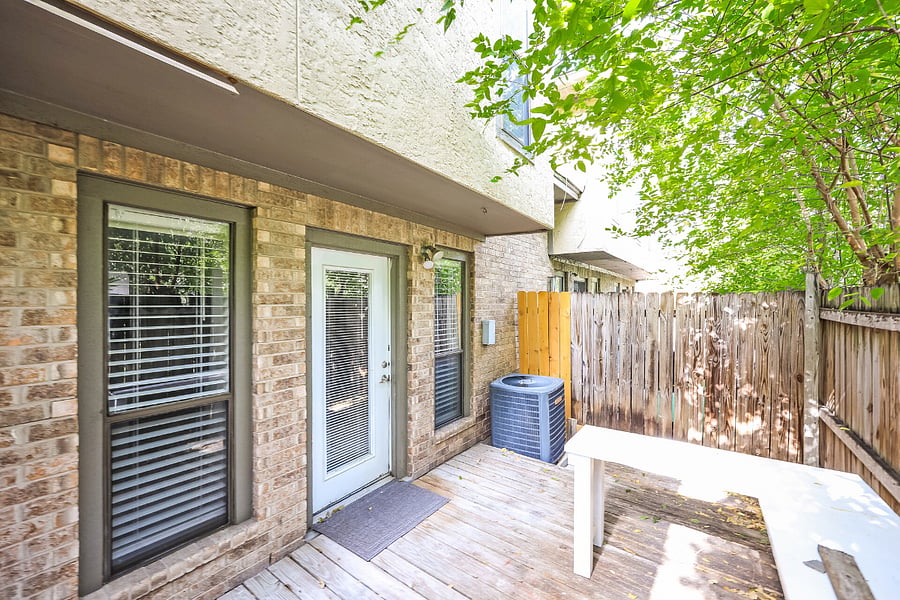 Private patio space for outdoor seating and fresh air.