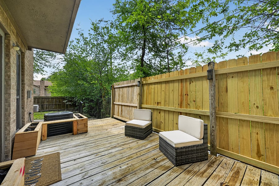Your private fenced deck with outdoor seating