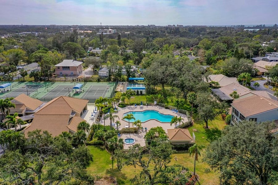 Community pool and tennis courts aerial view