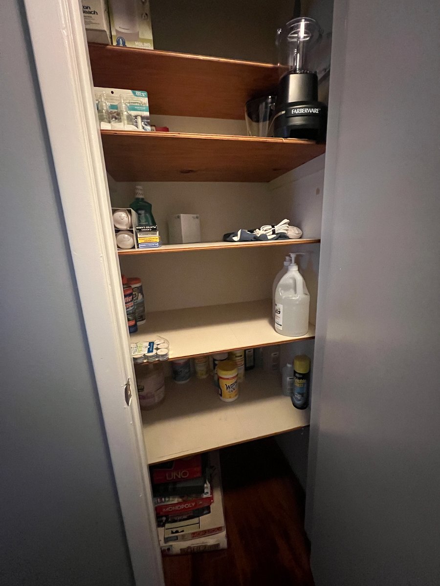 Hall closet with supplies and game night cards and board games