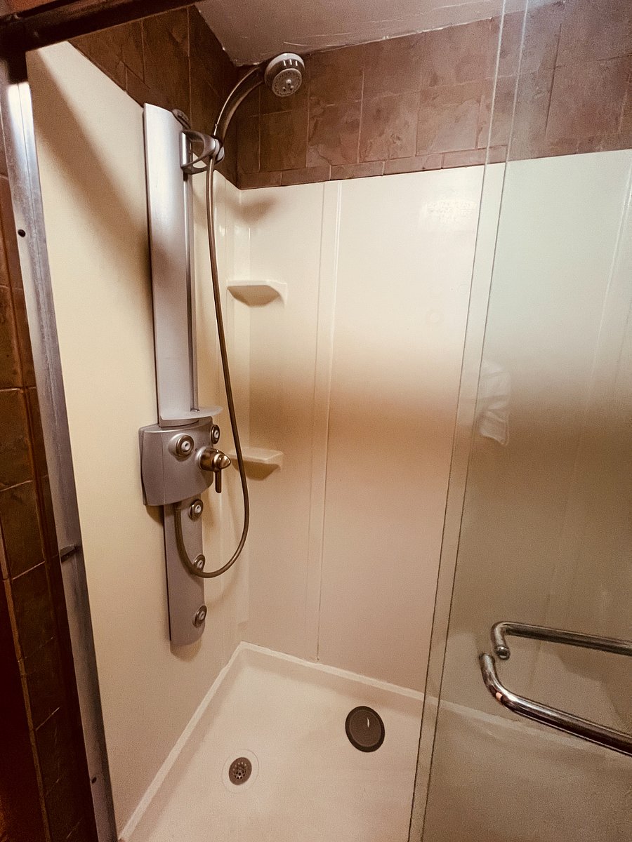 Ensuite bathroom with rain shower and base spray shower