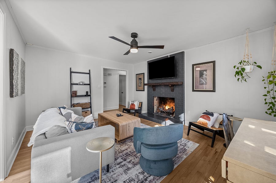 Den with Gas Burning Fireplace and Smart TV. Enjoy the cozy space to relax or play any of the several games provided.