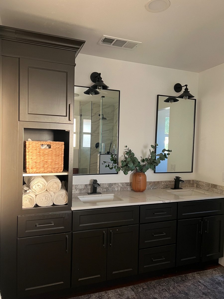 Master bath, dual vanity and cabinetry walk-in closet to the left