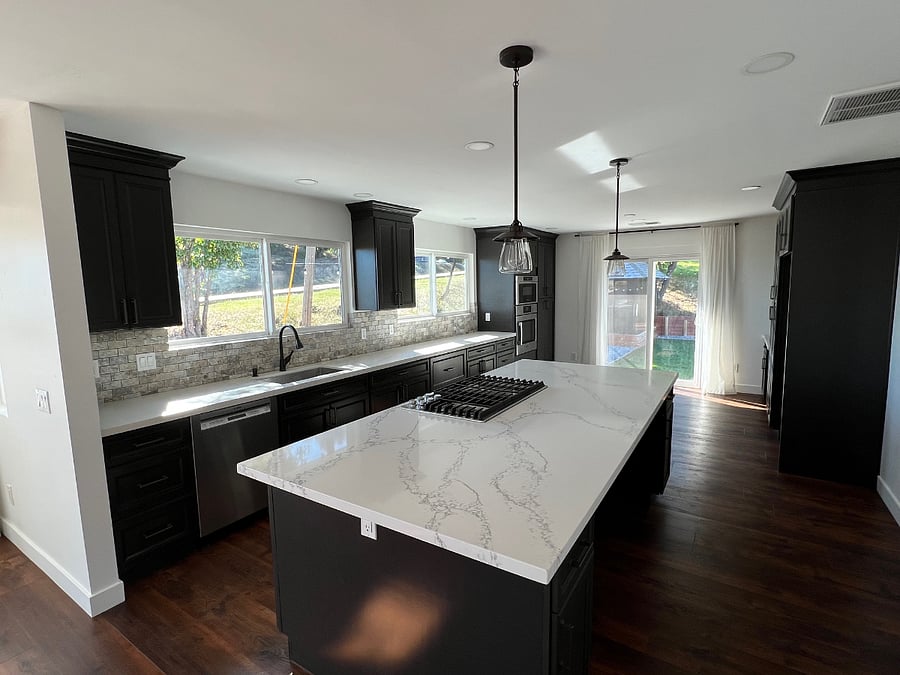 Kitchen and island sliding door to backyard.