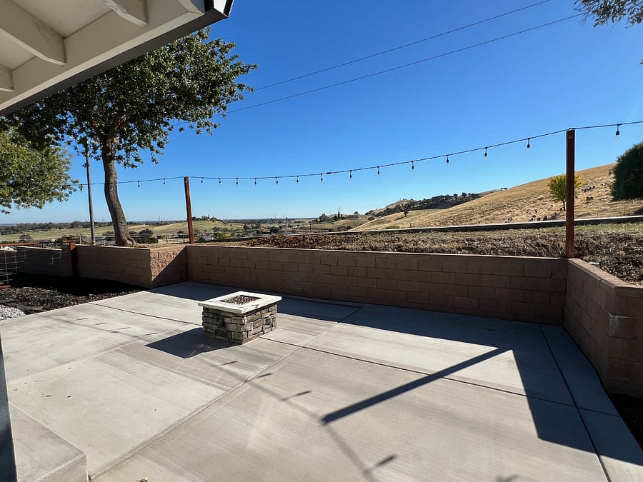 Side patio with views,fire pit and lighting.