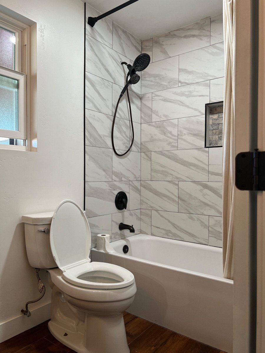 Shower tub combo and toilet in 2nd/hall bath.
