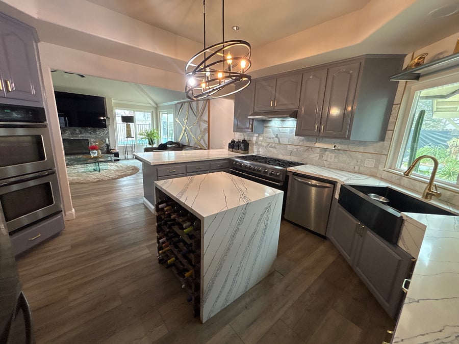 Shared gourmet kitchen has granite countertops, Viking stove, apron stainless steel sink, wine rack and double oven.