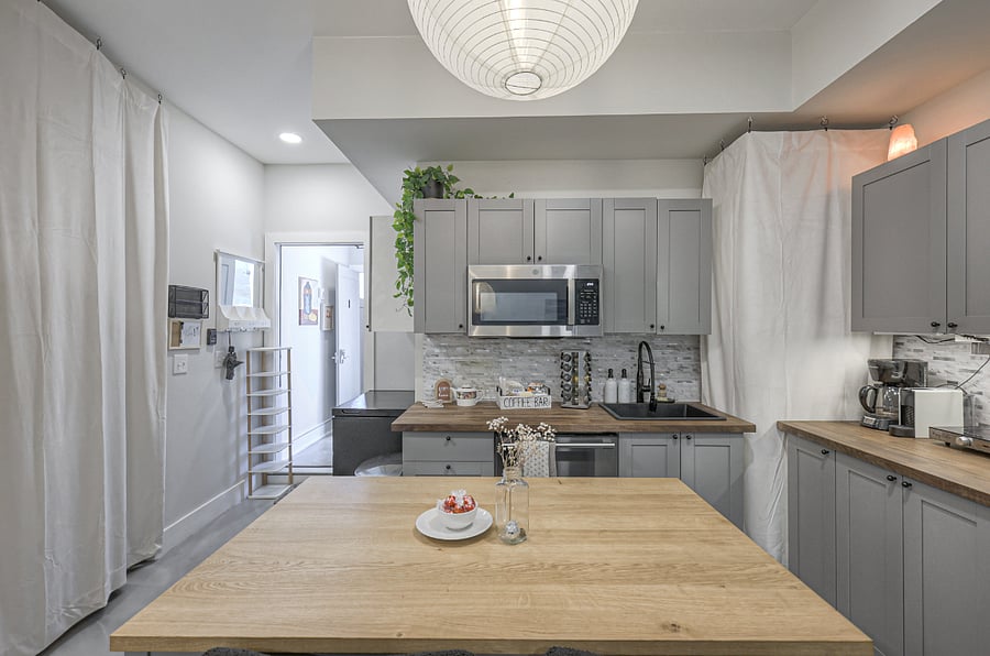 Fully equipped kitchen with sleek finishes and full-size appliances.
