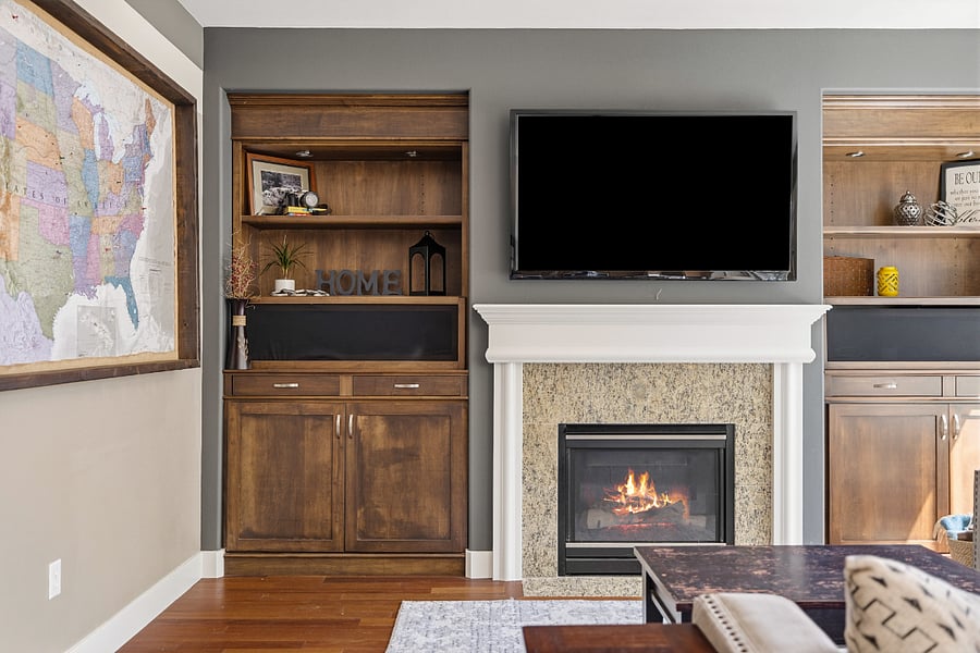Living room with smart tv and gas fireplace.