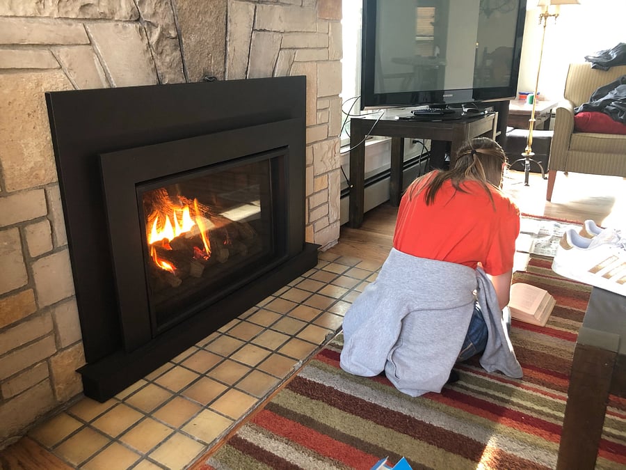 The gas fireplace "insert" pushes out a lot of heat. FYI it cost me $120 to get that model to sit there and look comfortable...you'd think I could have gotten her to face the camera...