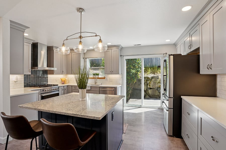 chef's kitchen with island, loads of storage and large refrigerator