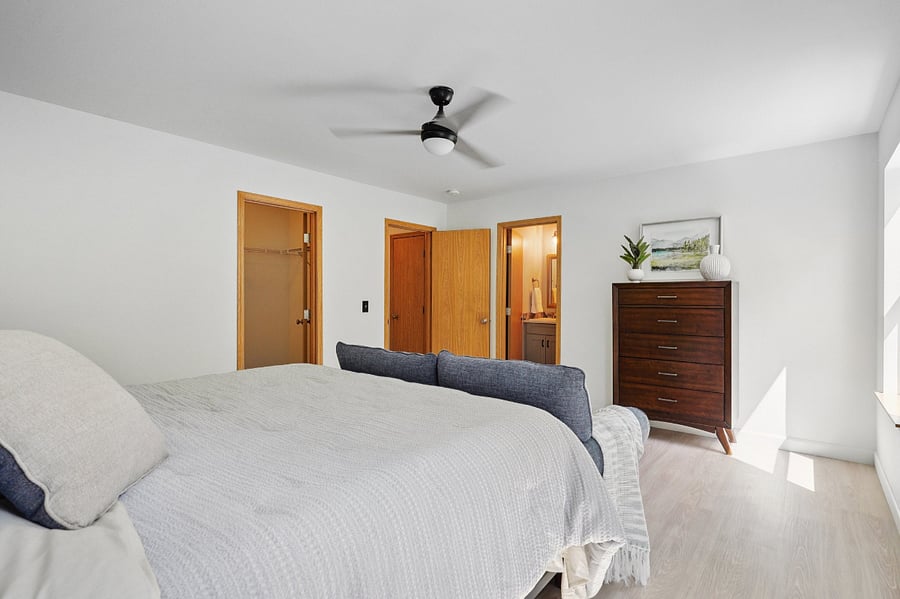 ensuite Primary bedroom with large walk in closet and updated bathroom