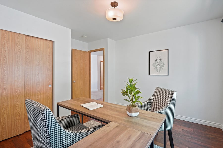 bedroom off the entry, this room has been furnished as a bedroom with a queen bed