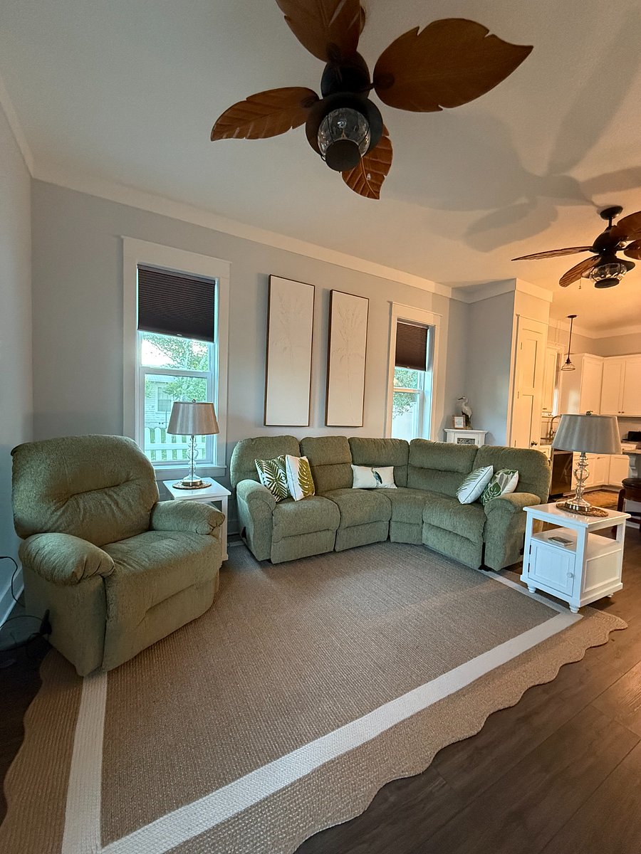 living room with reclining sofa and chair along with smart TV.