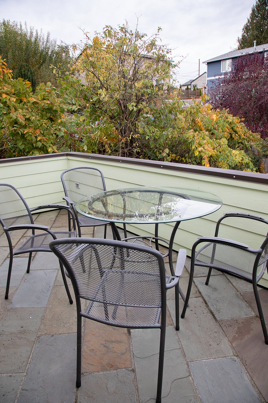 the back porch is on the west (sunset) side of the home. The front/east porch has a great Seattle view of the Space Needle and Ferris wheel, and catches the morning light.