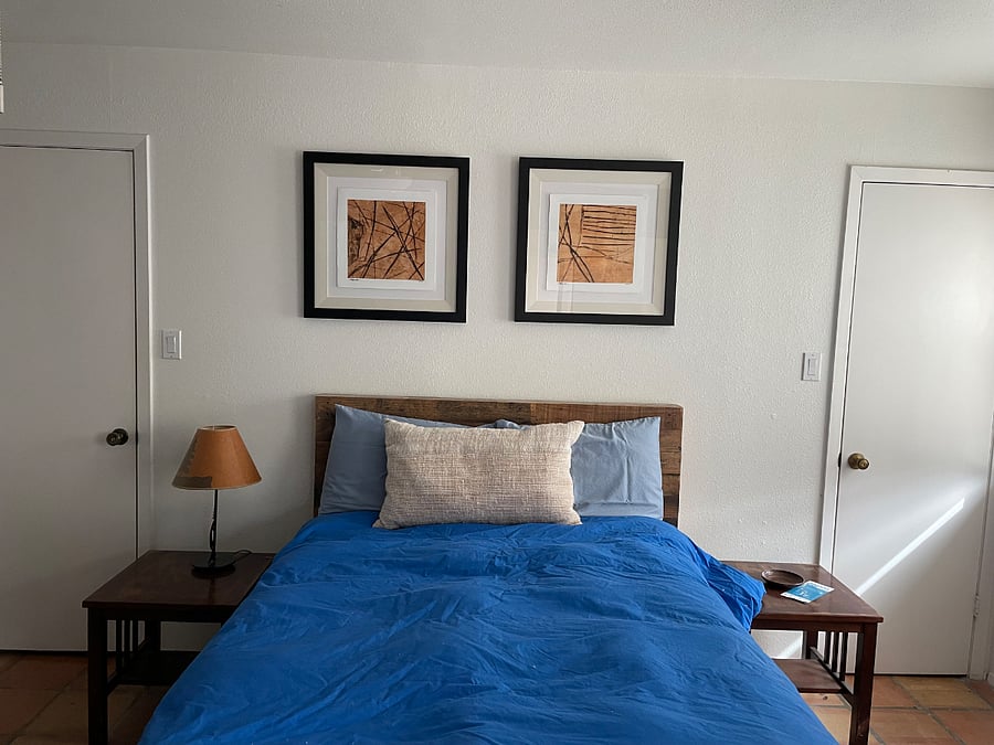This is primary master suite. Bathroom en suite. Doors on either side of bed are walk in closets.