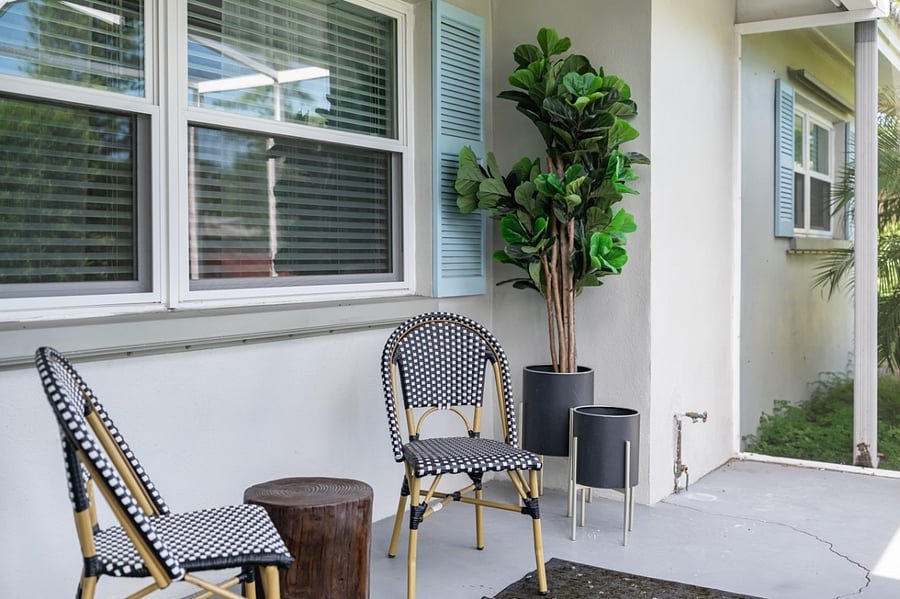 The screened-in front porch offers a space for morning coffee to enjoy the peacocks and other wildlife walking by.
