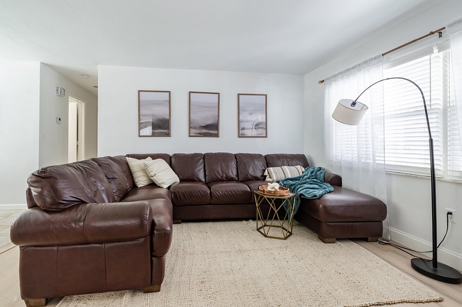 Living room with large, comfy leather couch.