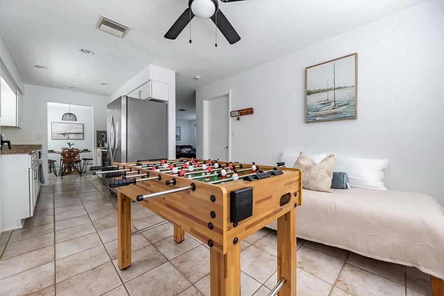 A Foosball table graces a bonus area leading out to the pool, where there is also an extra Lucid-band twin-sized bed.