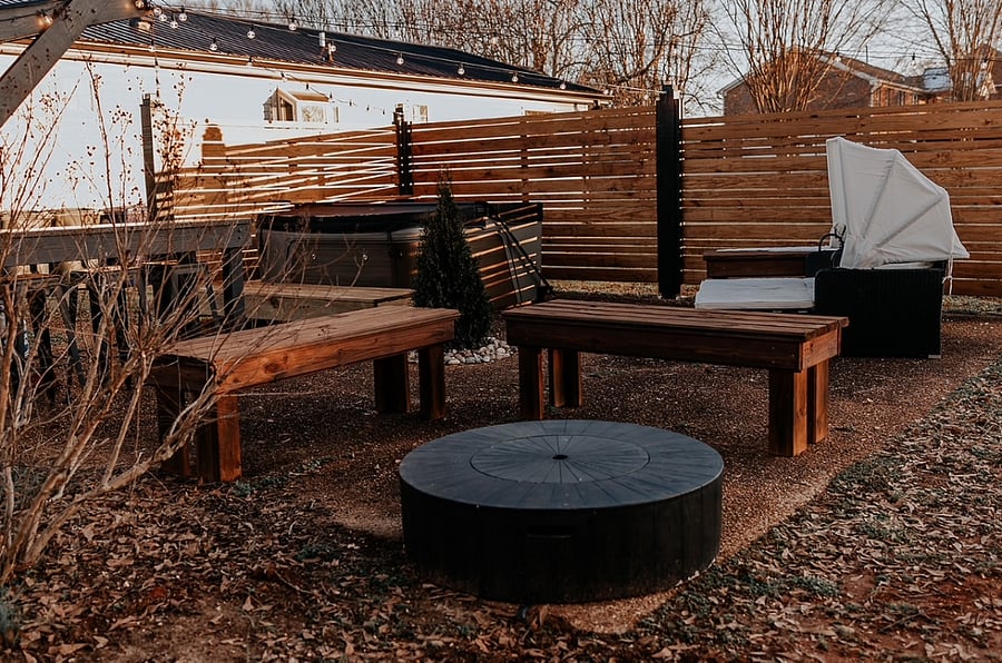 Outdoor seating with firepit and jacuzzi. Privacy screen. 