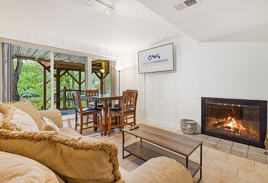 Lower Level - Living Recreational Area w/ Wood Fireplace, Smart TV, & Game Table