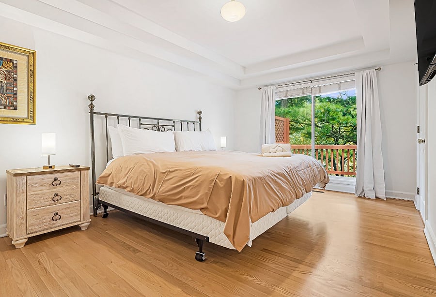 Bedroom One - King Bed w/ Smart TV & Attached Half Bath