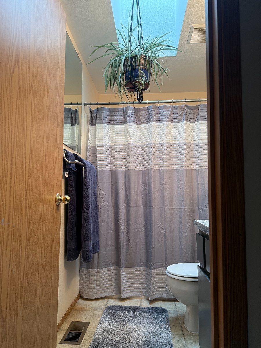 Bathroom features a second mirror for easy 360-degree views.