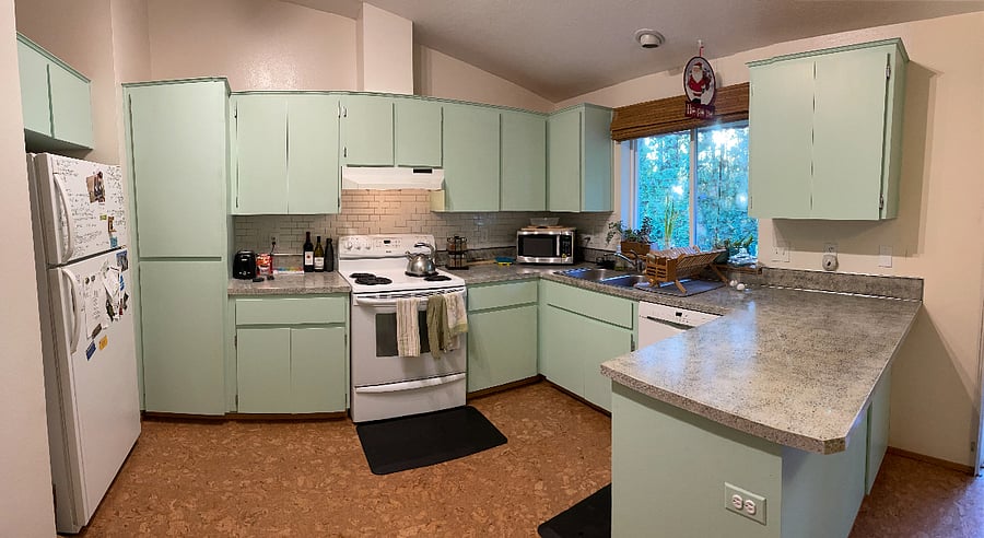 Fully equipped kitchen with fridge, stove, dishwasher, pantry, dishware, and garbage disposal