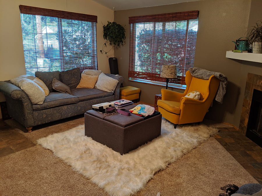 Living room with projector setup for movie nights or streaming on a big screen.