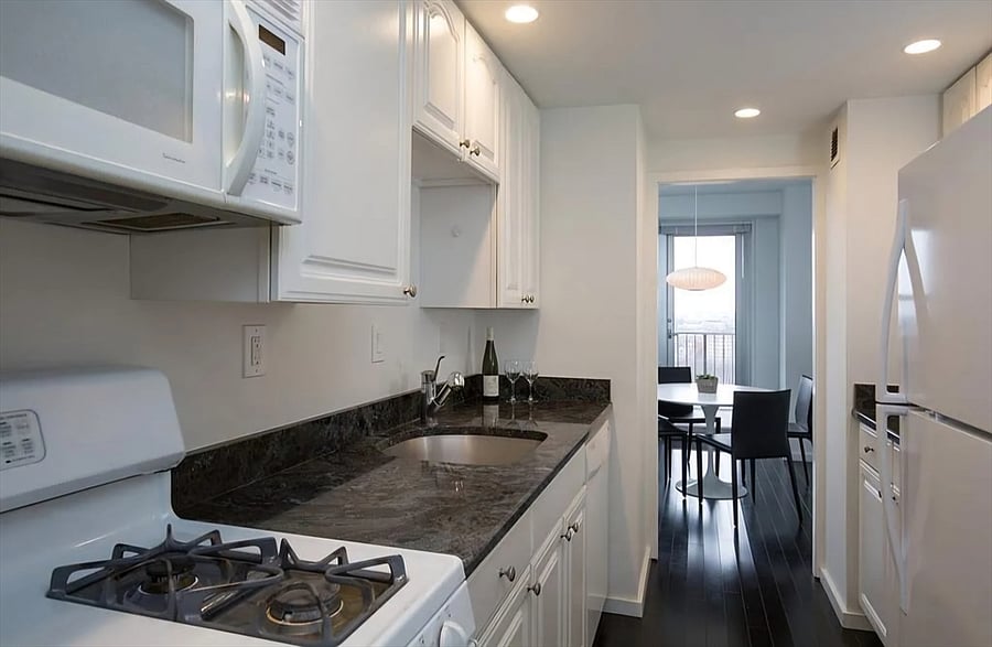 Fully equipped kitchen with full-size appliances, cookware, and dining essentials.