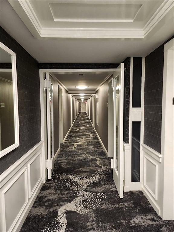 Clean, well-lit hallways with modern finishes and secure access.