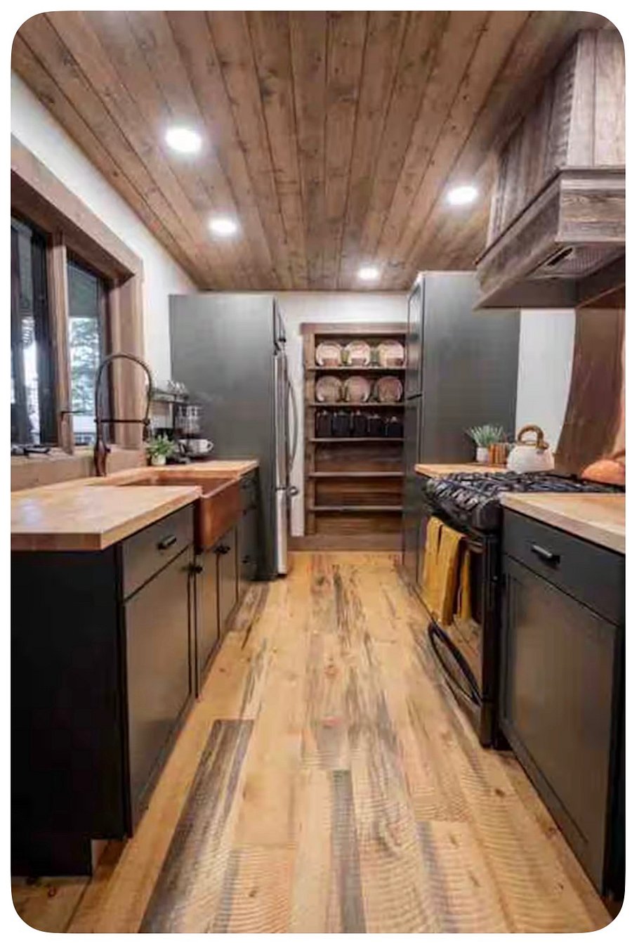 Full kitchen with microwave, stove, full fridge, coffee bar and spices