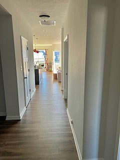 Walking in front door looking down hallway to kitchen, DR/LR