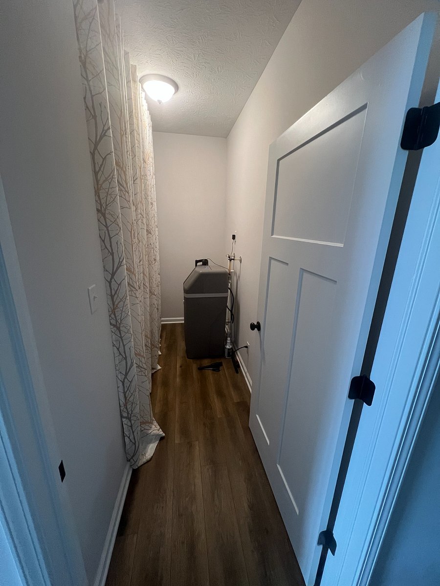 Utility room off hallway to right