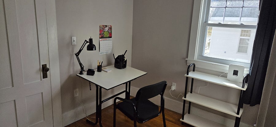 Second "bedroom" is set up as an office with worktop area, scissors, stapler, clips, tape, ruler, work light, bookcase, and the internet box. Blackout curtain.