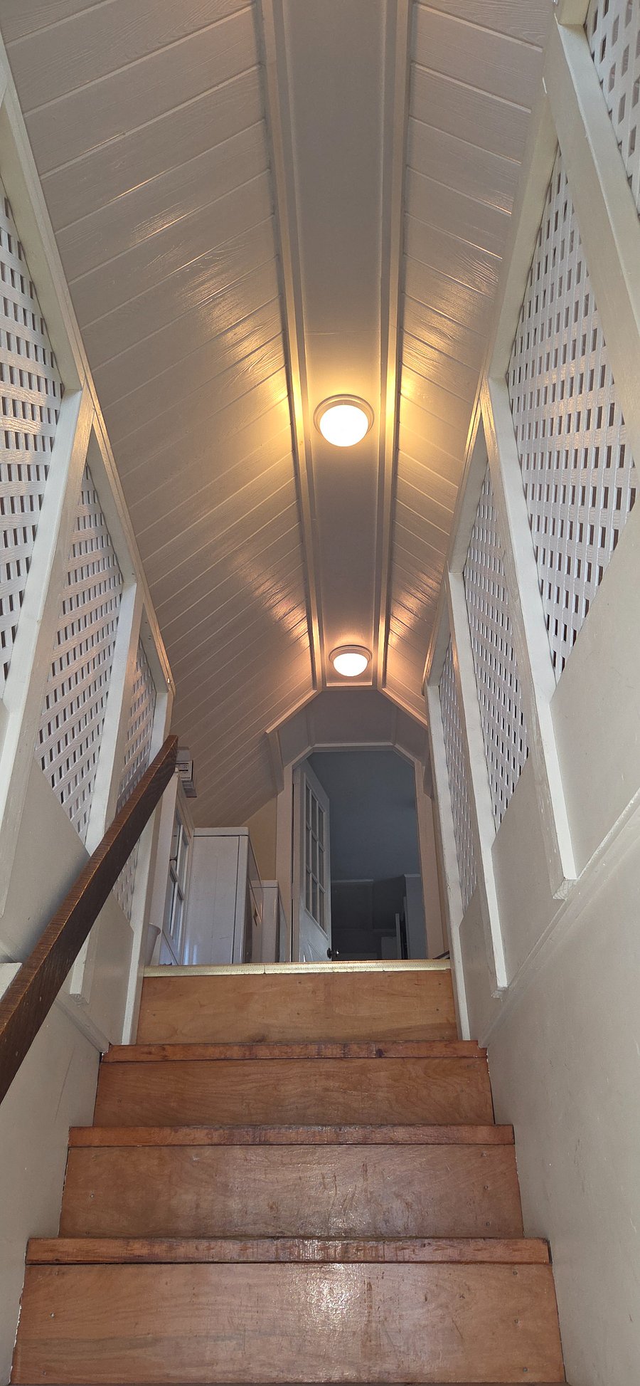 Entry stairs up to the apartment. Lots of light.
