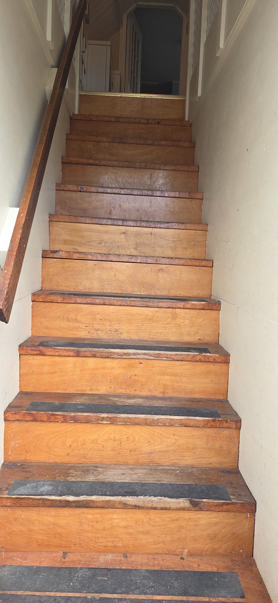 Entry stairs with non-slip threads and railing.