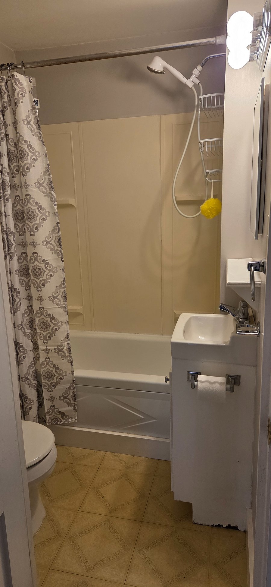 Bathtub, vanity, medicine cabinet