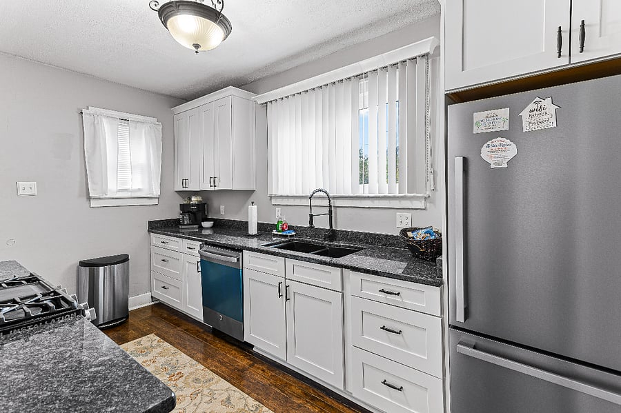 Apt. A Lower Flat kitchen.
Newly renovated full kitchen with granite countertops, new upgraded stainless-steel appliances, composite sink, garbage disposer.  Built in microwave, gas range, dishwasher, full sized refrigerator.  The kitchen is bright & airy. 
